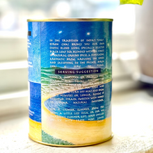 Load image into Gallery viewer, Tea canister with blue label and text on a blurred background