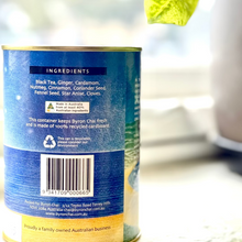 Load image into Gallery viewer, Close-up of a tea canister label with ingredients list and recycling symbol.