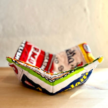 Load image into Gallery viewer, Colorful paper bowl made from recycled cereal boxes on a wooden surface.