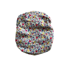 Load image into Gallery viewer, Floral-patterned fabric cover on a textured surface