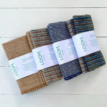 Load image into Gallery viewer, Three folded hand-woven dishcloths with 'LOOM' labels on a white wooden surface