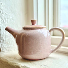 Load image into Gallery viewer, Pink ceramic teapot on a windowsill with natural light