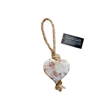 Load image into Gallery viewer, Heart-shaped stone ornament with a rope on a textured beige surface