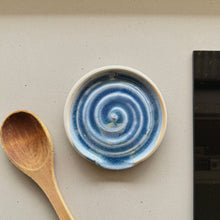 Load image into Gallery viewer, Ceramic dish with blue spiral pattern next to a wooden spoon on a neutral surface