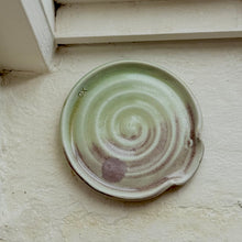 Load image into Gallery viewer, Ceramic plate with spiral design on a textured surface