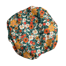 Load image into Gallery viewer, Floral-patterned fabric cover on a textured surface