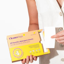 Load image into Gallery viewer, Person holding a box of Cleaner Days laundry detergent sheets against a white background
