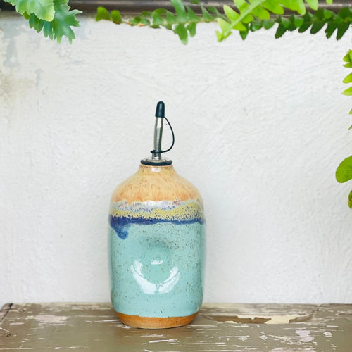 handmadeoilbottlepotterybymonspotsavaiableonberealco.
