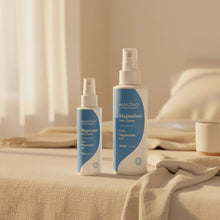Load image into Gallery viewer, Two bottles of Amazingri Magnesium Oil on a beige surface with a neutral background
