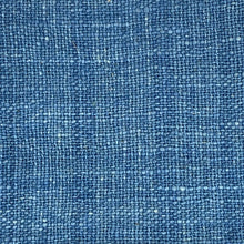 Load image into Gallery viewer, Close-up of blue denim fabric texture
