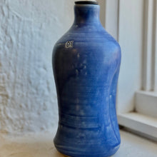 Load image into Gallery viewer, Blue ceramic oil bottle with a metallic nozzle on a neutral background
