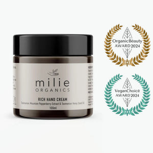 Milie Organics rich hand cream jar with awards on a white background