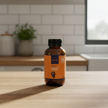 Load image into Gallery viewer, A bottle of Country Good Hemp 8mg Hemp Oil Capsules with a black cap and an orange label, photographed on a light gray background.
