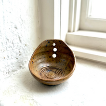 Load image into Gallery viewer, Ceramic dish with spiral design and three holes on a light surface.
