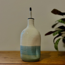 Load image into Gallery viewer, Decorative bottle with a gradient design on a wooden surface
