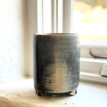 Load image into Gallery viewer, Black ceramic pot on a windowsill with natural light
