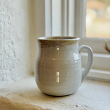 Load image into Gallery viewer, Ceramic mug on a windowsill with natural light
