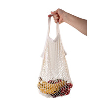 Load image into Gallery viewer, Hand holding a string bag filled with fruits on a white background
