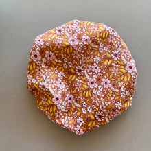 Load image into Gallery viewer, Floral-patterned fabric cover on a plain background
