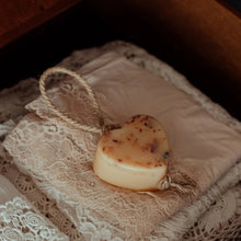 Load image into Gallery viewer, Heart-shaped object on a lace fabric with a wooden surface in the background
